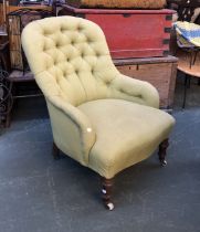 A 19th century button back armchair upholstered in pale green fabric, on turned front legs and