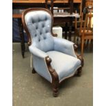 A Victorian mahogany button back armchair, upholstered in blue