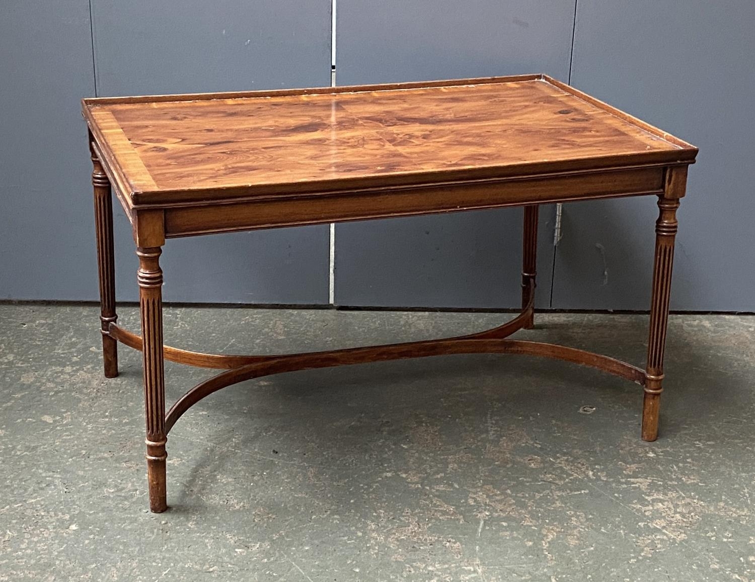 A yew veneered coffee table, on fluted tapering legs, 82x51x48cm