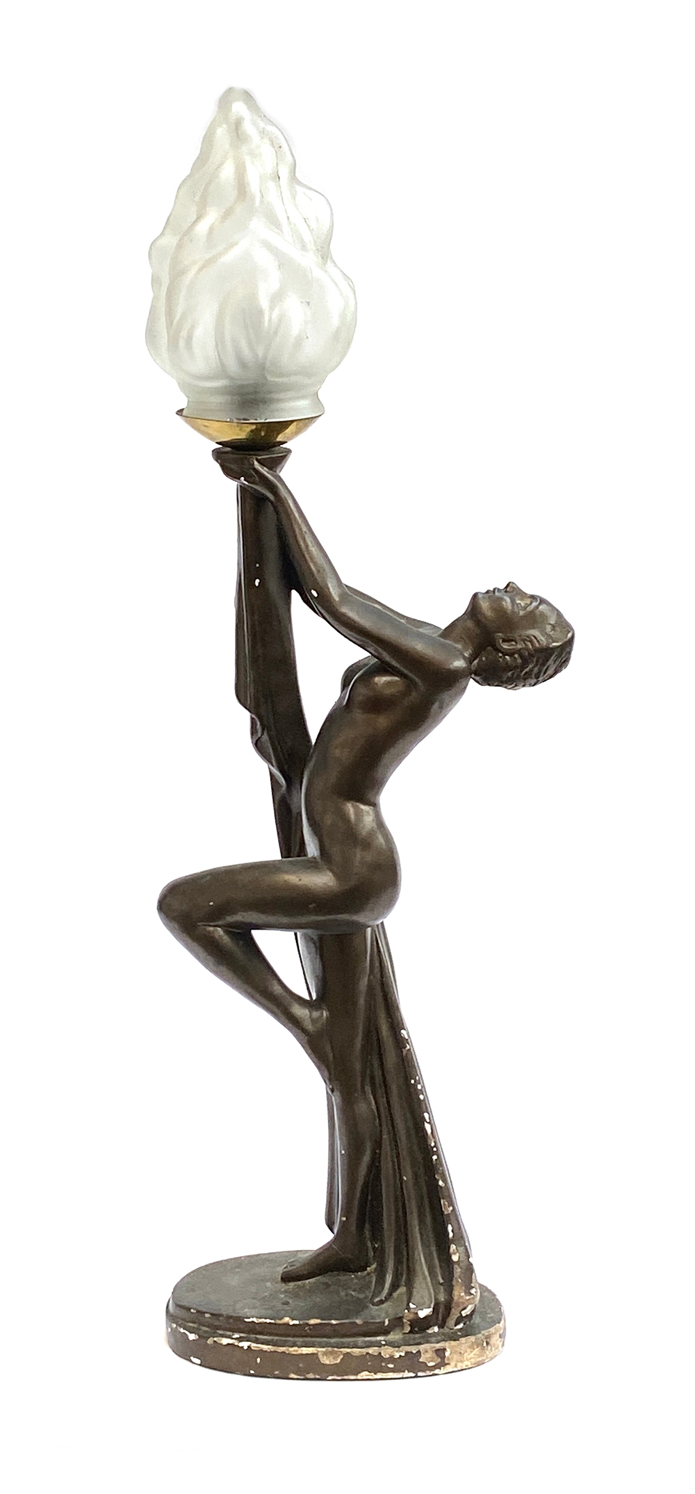 An Art Deco bronze effect plaster figural table lamp in the form of a nude female figure holding a