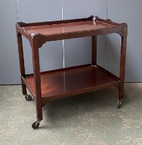 A mahogany two tier hostess trolley on oversized casters, 76x51x72cmH