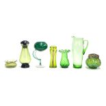 A quantity of green glass to include jugs, vases, decanter, etc, the tallest 32cmH