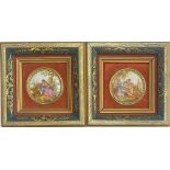 A pair of framed Limoges style porcelain roundels depicting courting continental couples, the