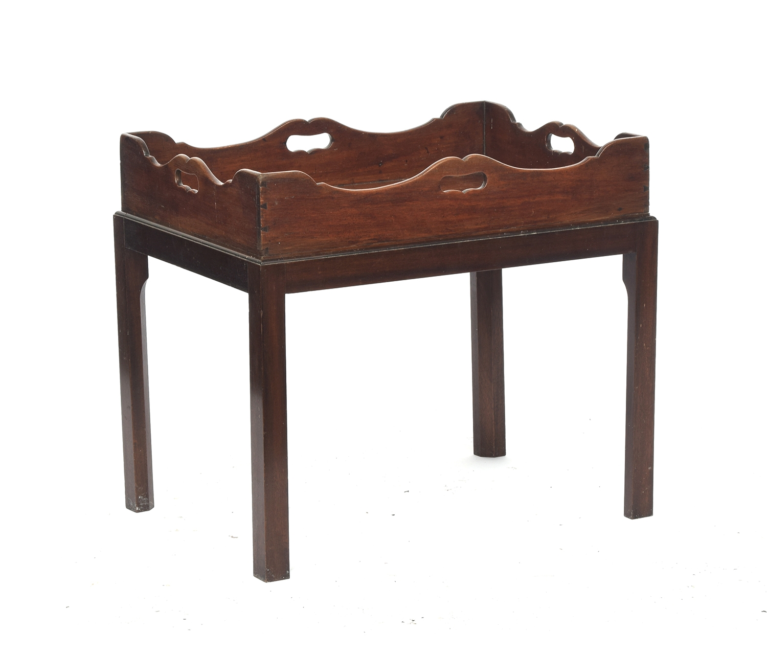 A 19th century mahogany butler's tray, shaped gallery with handle cutouts on all sides, on a later