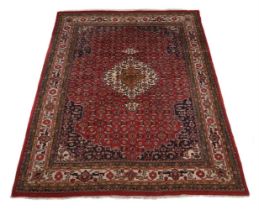 A North West Persian carpet, with red ground, approx. 350x260cm