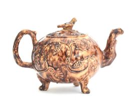 A mid 18th century English creamware Whieldon type teapot and cover c.1750 (restored), of globular