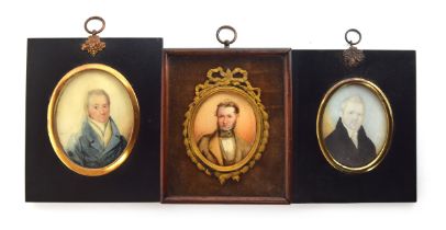 Three 19th century portrait miniatures of Regency gentleman, one inscribed to verso 'Painted by John