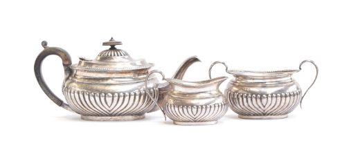 An Edwardian three piece teaset in George III style, by S W Smith & Co, London 1904, comprising