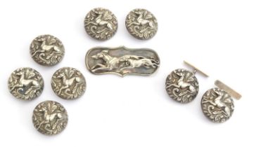 A pair of early 20th century silver cufflinks, chased with recumbent longdogs and acanthus leaves,