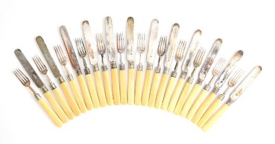 A set of twelve bone handled dessert knives and forks by Goldsmiths & Silversmiths Co (William