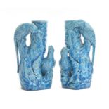 A pair of Chinese turquoise glazed vases modelled with parrots on a tree, 25.5cm high