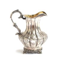 An early Victorian milk jug by Frederick Dear, London 1841, of lobed form, with scrolling acanthus