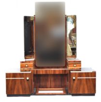 A French Art Deco maccasar ebony dressing table, triple plate mirrors, three plain frieze drawers