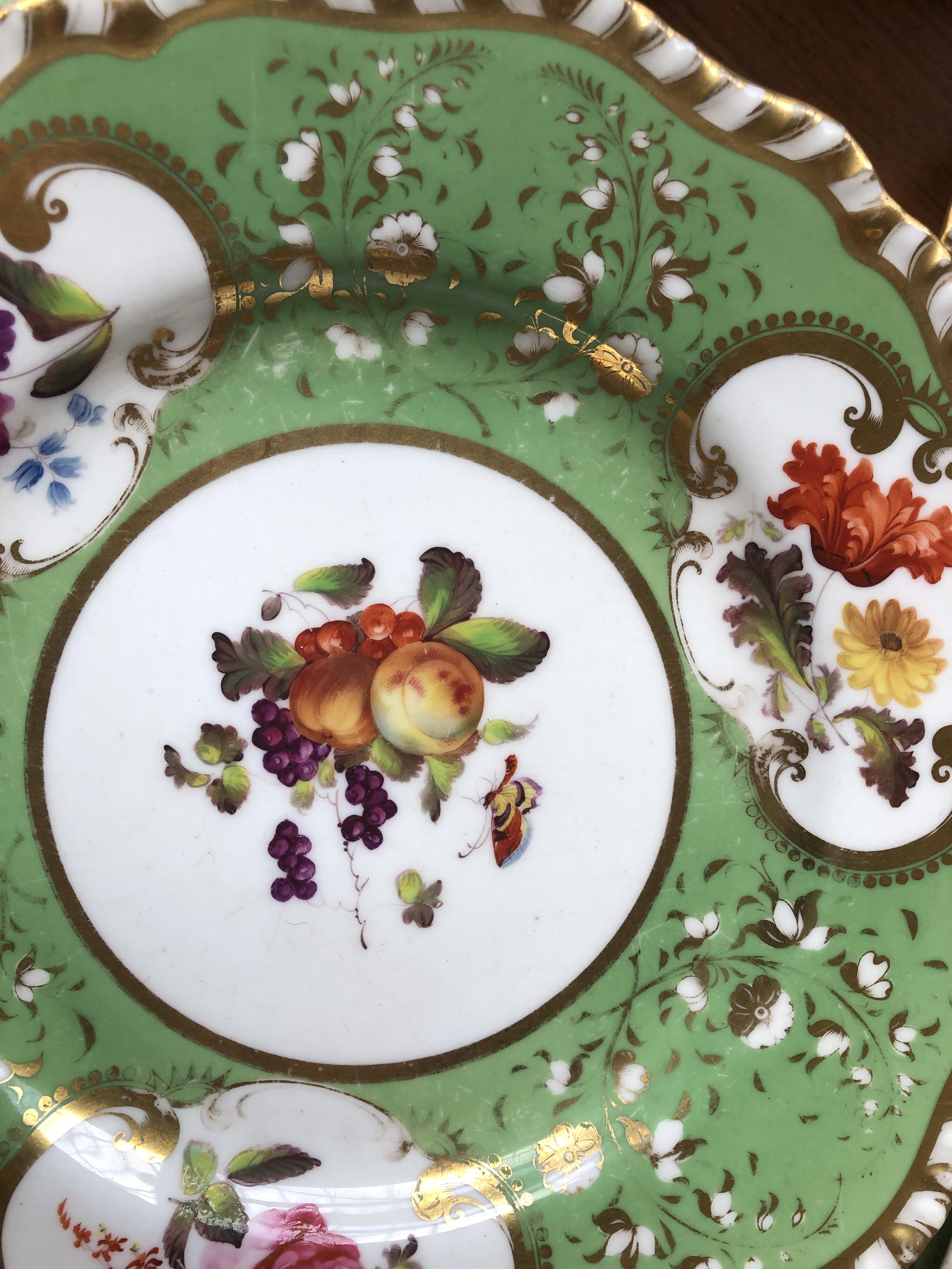 A 19th century hand painted dinner service, floral panels on a green ground, heightened in gilt, - Image 9 of 10