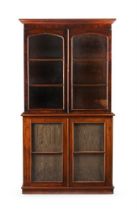 A Victorian mahogany bookcase, the four glazed doors enclosing shelves, the lower doors lined with