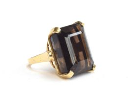 A large gold mounted smoky quartz cocktail ring, the emerald cut quartz approx. 25x20mm, unmarked