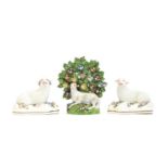 A Staffordshire pearlware ram figurine, with encrusted bocage, 14cm high; together with a pair of