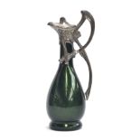 A green glass and white metal claret jug, iridescent green glass bottle body with WMF style white