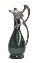 A green glass and white metal claret jug, iridescent green glass bottle body with WMF style white