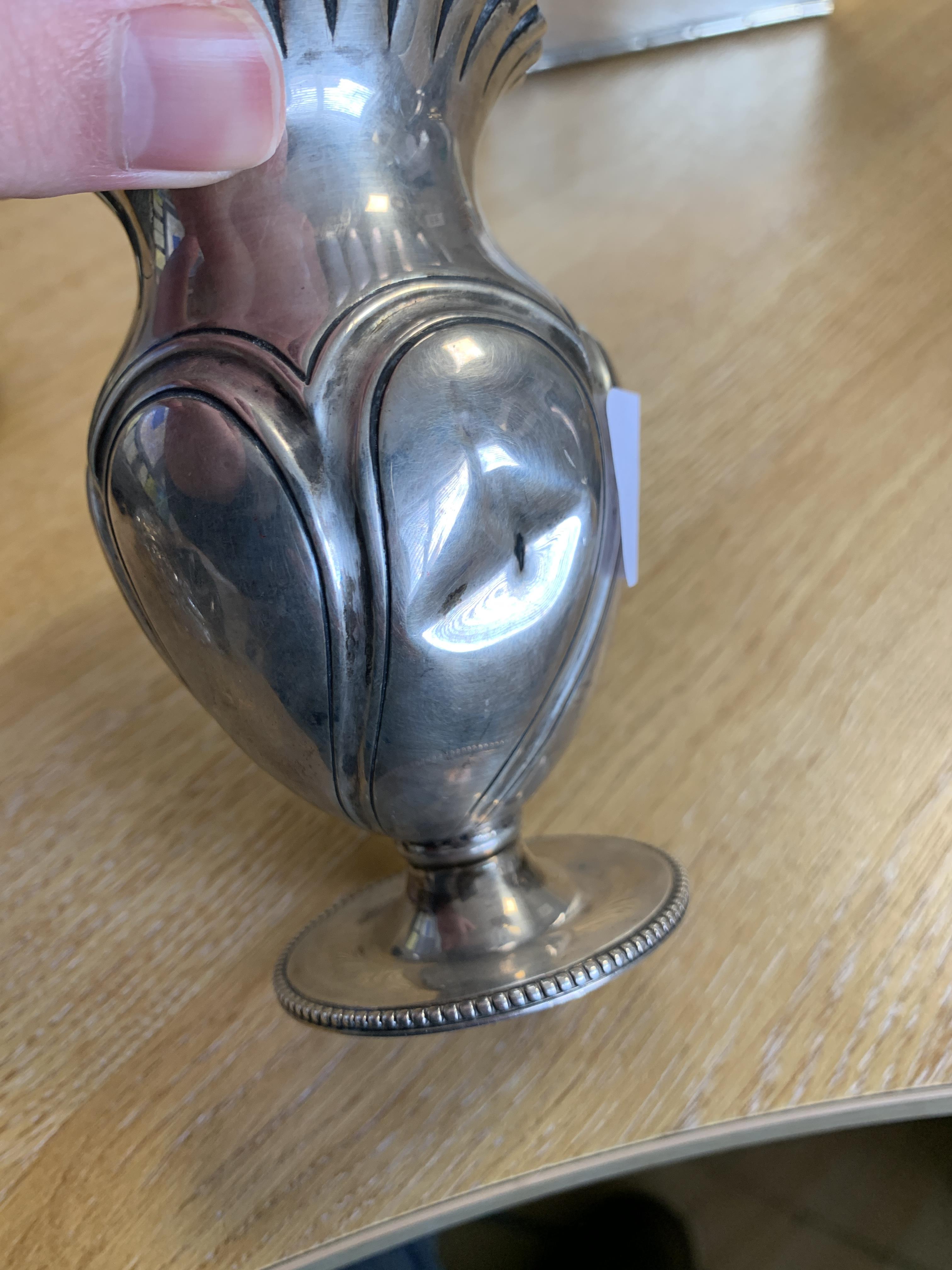 A late Victorian silver bowl by Norton & White, Birmingham 1899, heavily chased with scrolls and - Image 4 of 4