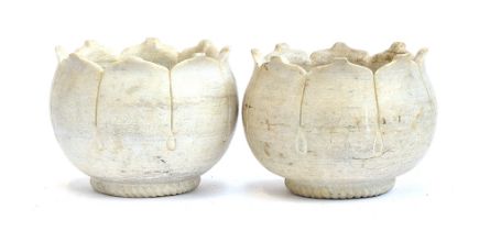 A pair of carved marble planters in the form of lotus flowers, 22cm high, 29.5cm diameter