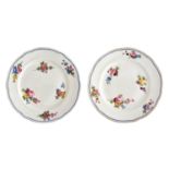 A pair of Nantgarw porcelain plates, hand painted with floral sprays, impressed mark to base, 24cm