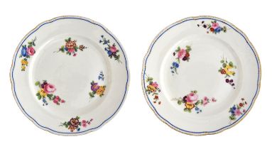 A pair of Nantgarw porcelain plates, hand painted with floral sprays, impressed mark to base, 24cm