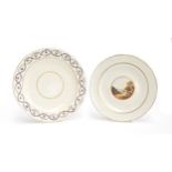 Two W(***) porcelain plates, one hand painted with a landscape castle scene, heightened in gilt,