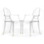 A pair of Louis Ghost open arm chairs by Philippe Starck for Kartell