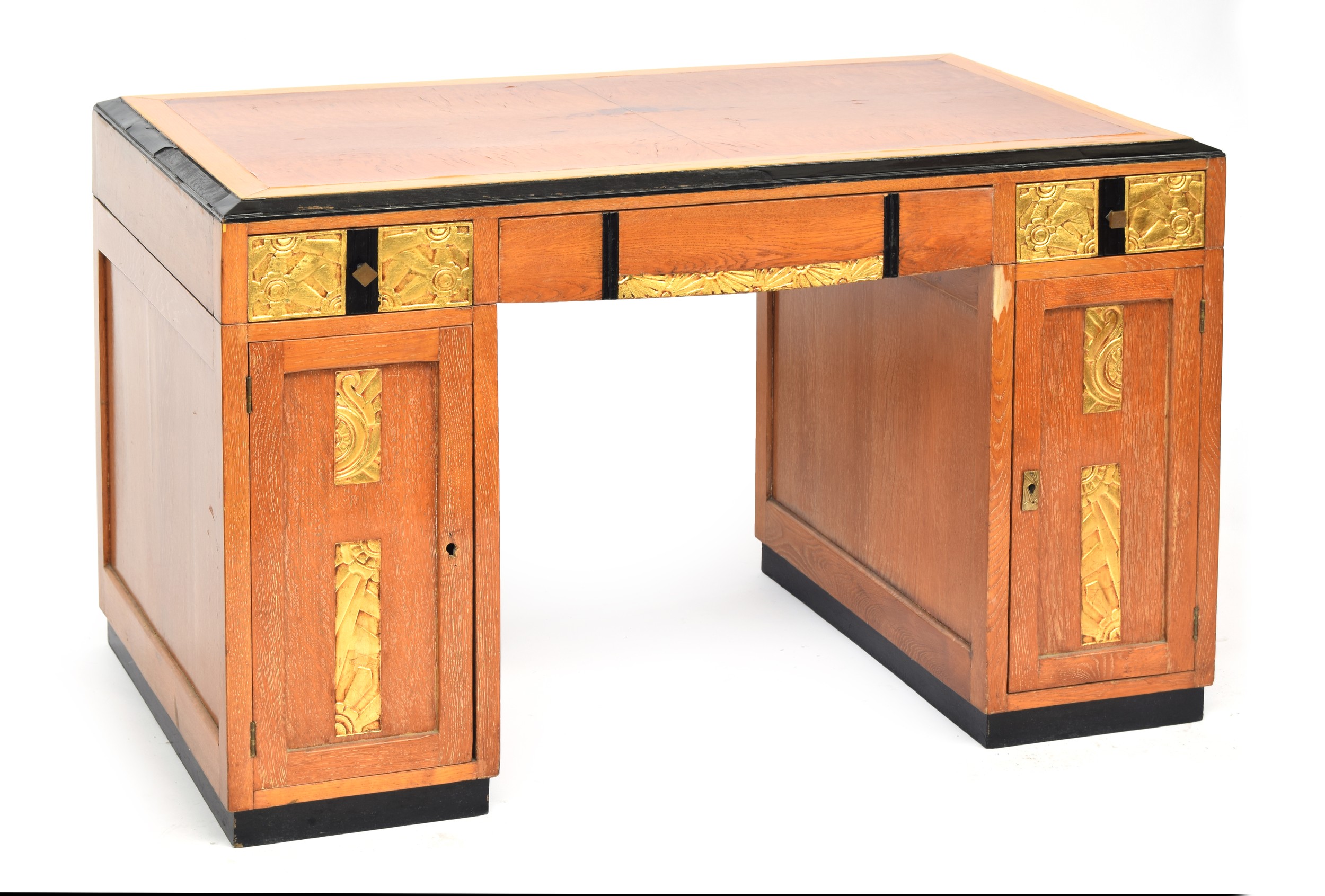 A French Art Deco pedestal desk, parcel gilt and ebonised, with carved foliate and scallop panels, - Image 2 of 3