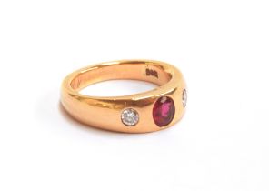 A heavy 14ct gold gypsy ring set with a ruby and two diamonds, the ruby approx. 0.4cts, size M 1/