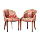 A pair of French Art Deco tub chairs, raised on square tapered legs with ebonised and ivorine inlay,