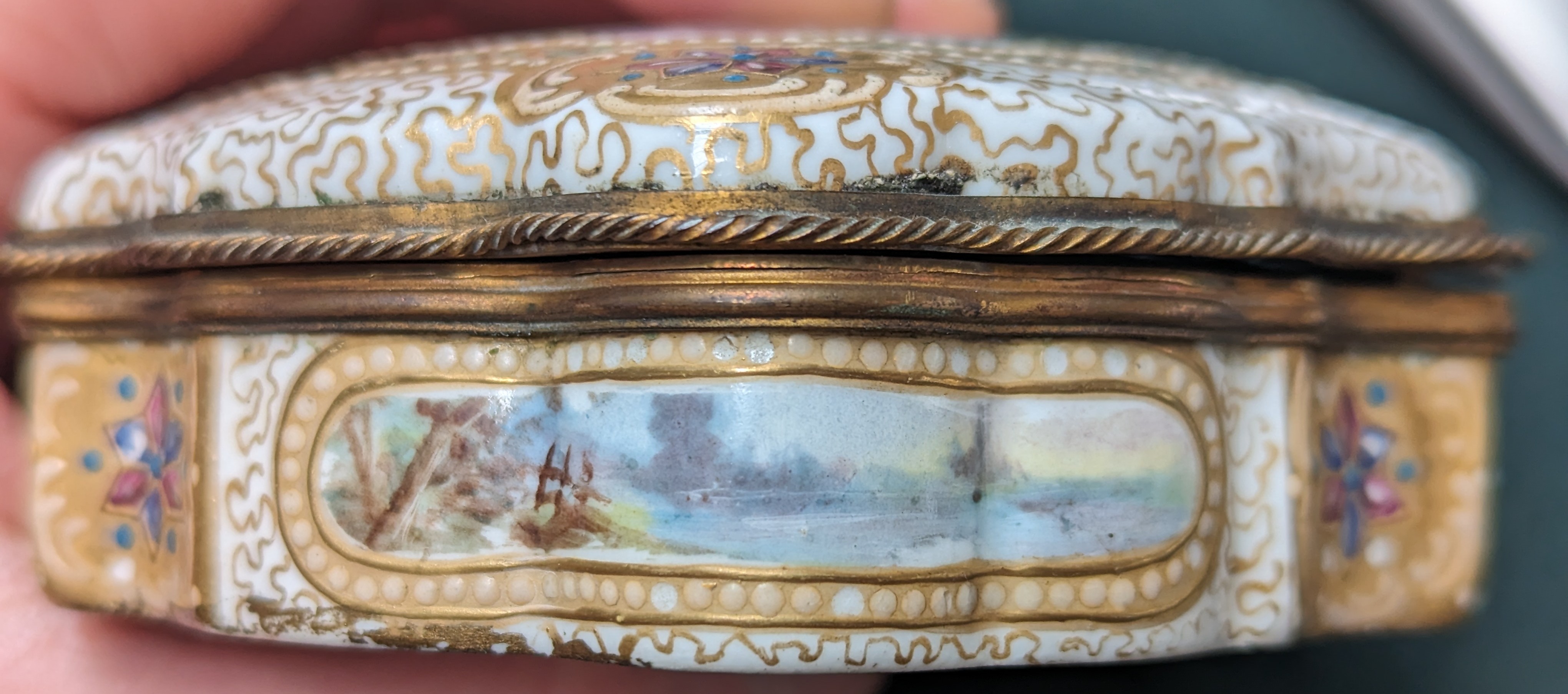 A 19th century gilt metal mounted porcelain box, hand painted with pastoral scenes and heightened in - Image 8 of 11