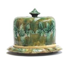 A 19th century majolica cheese cloche with leaf and berry design, 23cm high, 29cm diameter