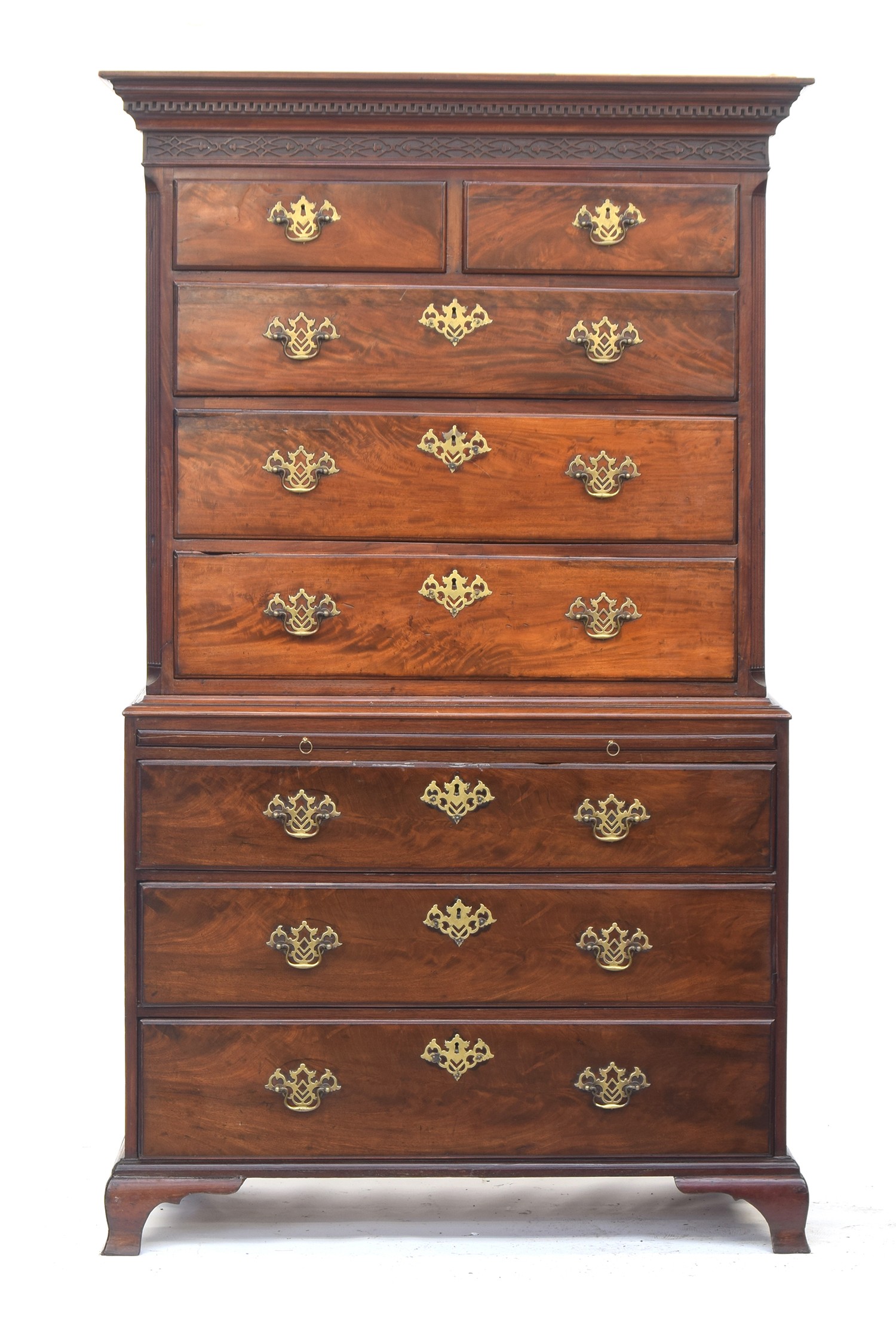A George III chest on chest, dentil cornice over two short and three long drawers flanked by