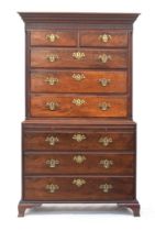 A George III chest on chest, dentil cornice over two short and three long drawers flanked by