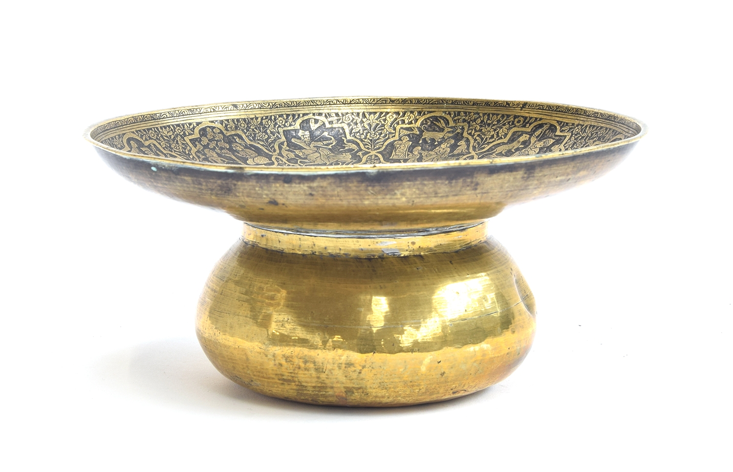 A 19th century Islamic Qajar engraved brass spittoon, the engraved panels depicting various hunts
