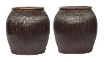 A pair of very large terracotta planters, 63cm diameter, 68cm high