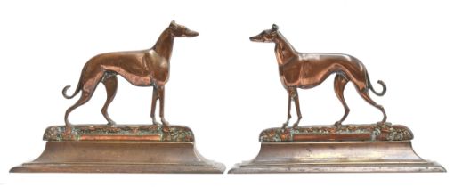 Coursing interest: a pair of 19th century brass door stops, modelled as a bitch and a dog, each base