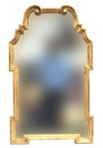 An Italian LaBarge giltwood mirror, c.1960s, the scrolled cresting over geometric shaped plate,