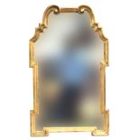 An Italian LaBarge giltwood mirror, c.1960s, the scrolled cresting over geometric shaped plate,