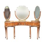 An early 20th century burr walnut veneer parcel gilt kidney shaped dressing table, with three