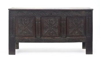 A 17th century three panel oak coffer, 121cm wide, 47cm deep, 66cm high