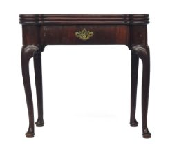 A George III mahogany triple action tea and card table, the hinged top enclosing a tea table and a