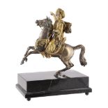 A gilt and patinated metal model of a mameluke, the horse and rider stood on a rectangular marble