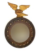 A Regency gilt gesso and later painted circular convex mirror, the apparently original plate