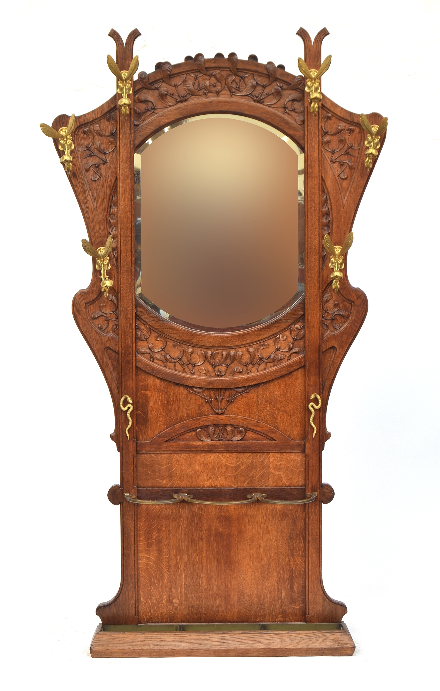 A French Art Nouveau oak and gilt metal hall stand retailed by Goumain Freres, c.1880, the central