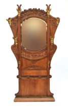 A French Art Nouveau oak and gilt metal hall stand retailed by Goumain Freres, c.1880, the central