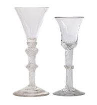 Two airtwist wine glasses, mid-18th century, one with a double-knopped stem filled with spiral