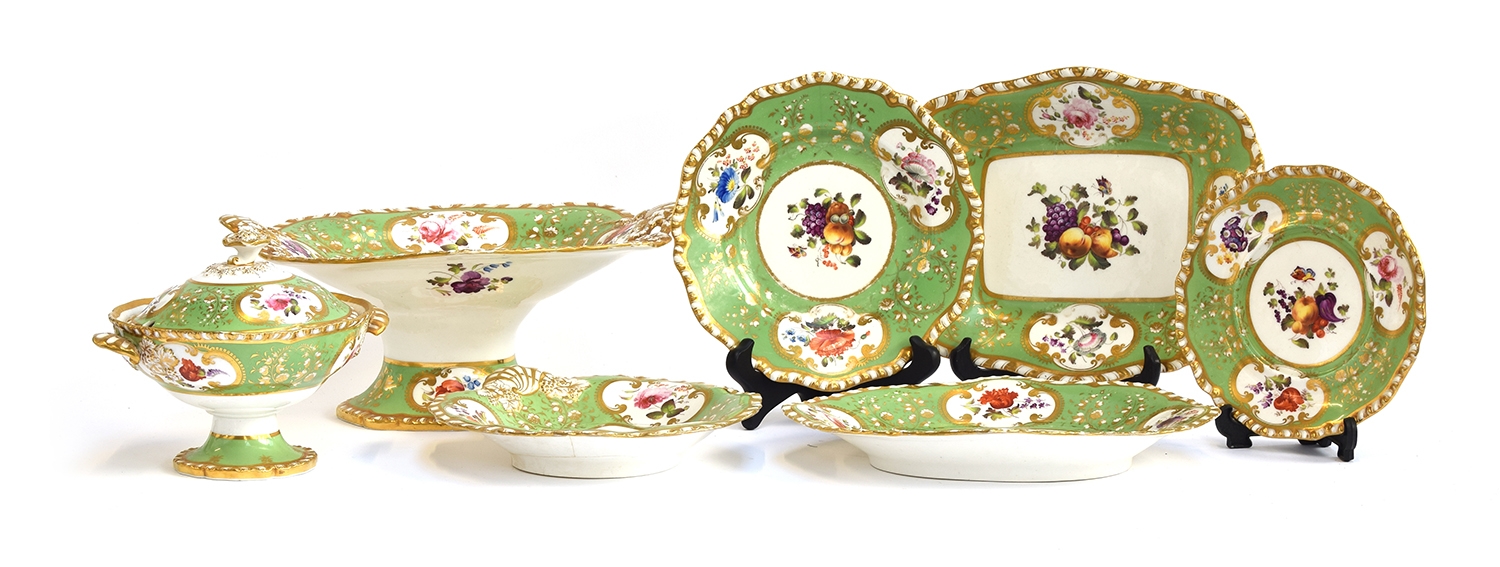 A 19th century hand painted dinner service, floral panels on a green ground, heightened in gilt,